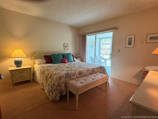 2929 Southeast Ocean Boulevard, Unit 1306 Stuart, FL 34996 - Photo 8 of 17 a bedroom with a bed and wooden floor