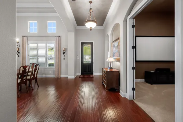 a view of a livingroom with furniture and wooden floor