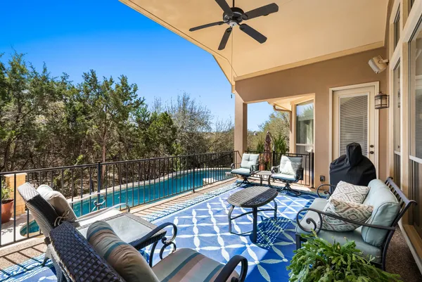 a outdoor space with patio the couches and pool table with chairs