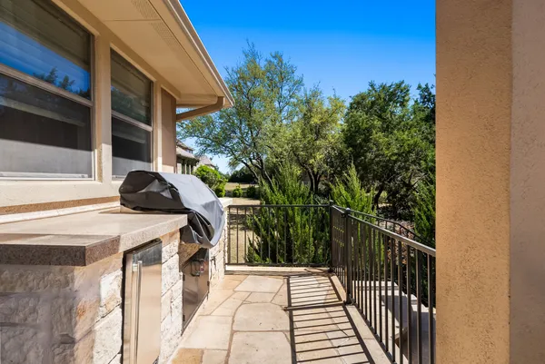 a view of balcony and yard