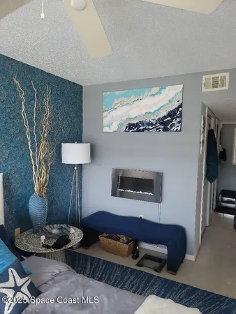 a living room with furniture and a lamp
