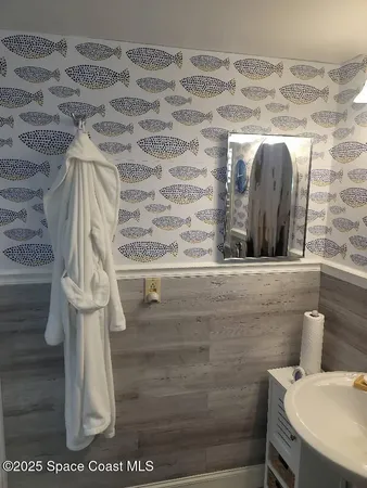 a bathroom with a sink and mirror
