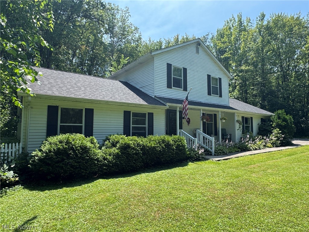 8201 Orchard Road Painesville, OH 44077 - Photo 2 of 45 Two-story residence featuring white siding and dark shutters