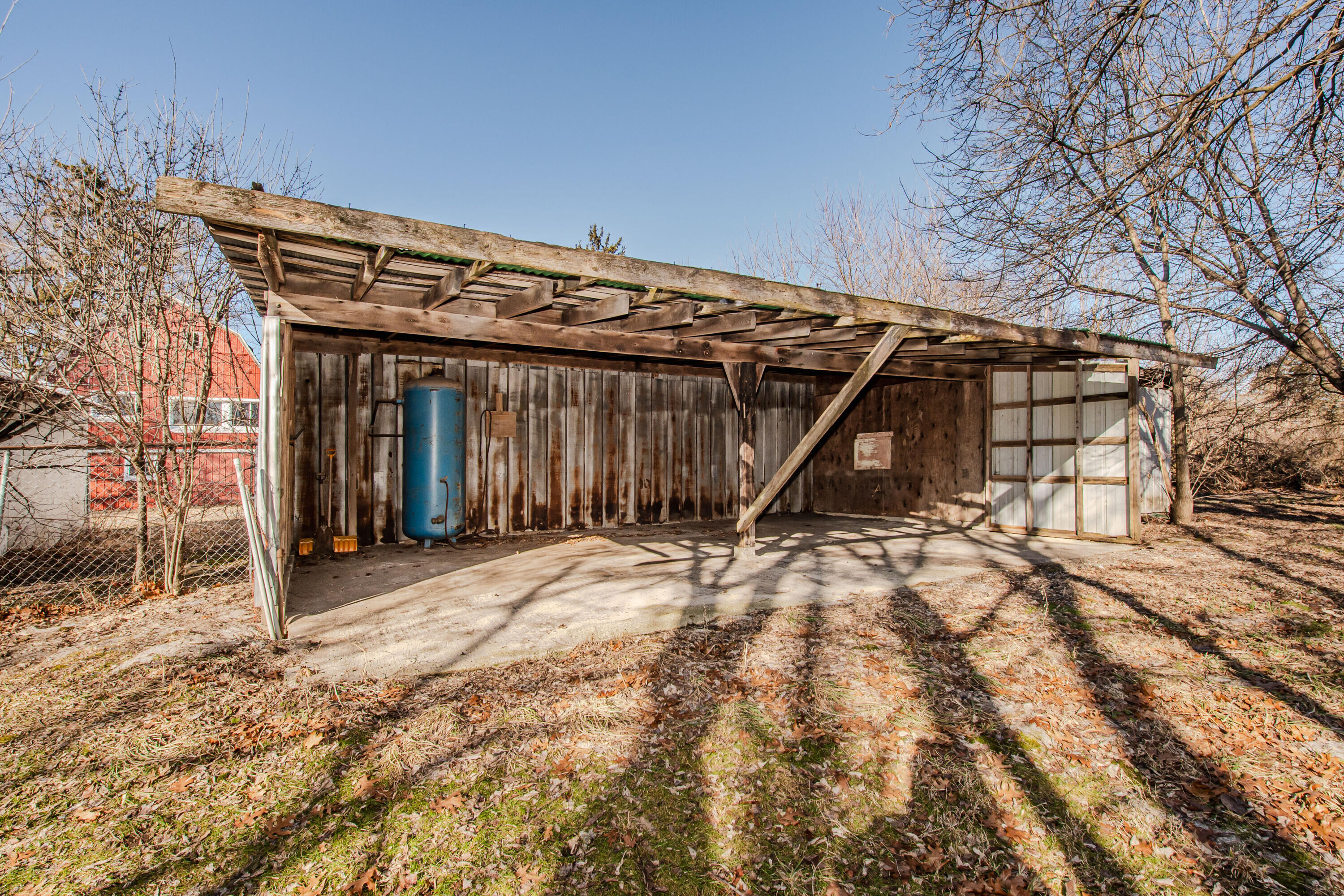 7130 Platt Road Saline, MI 48176 - Photo 61 of 79 Back of Red Metal Shed w extra air t