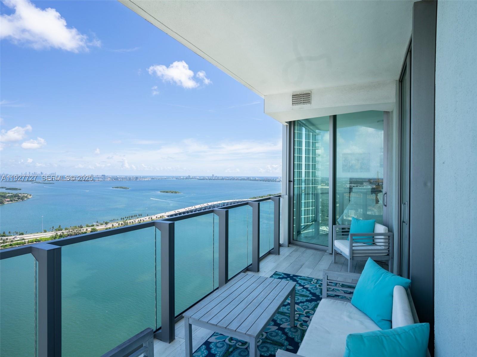 2900 Northeast 7th Avenue, Unit 4301 Miami, FL 33137 - Photo 1 of 24 a view of a balcony with furniture