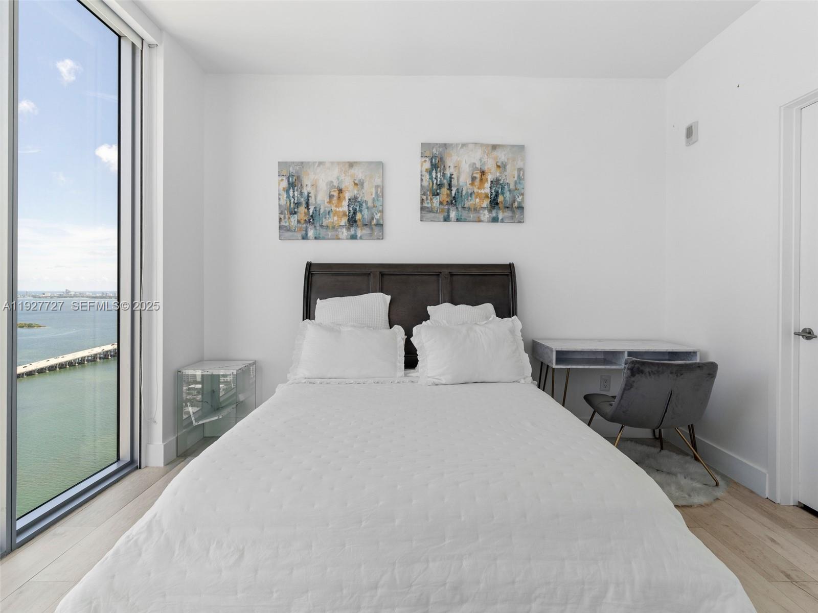 2900 Northeast 7th Avenue, Unit 4301 Miami, FL 33137 - Photo 11 of 24 a bedroom with a bed and a painting on the wall