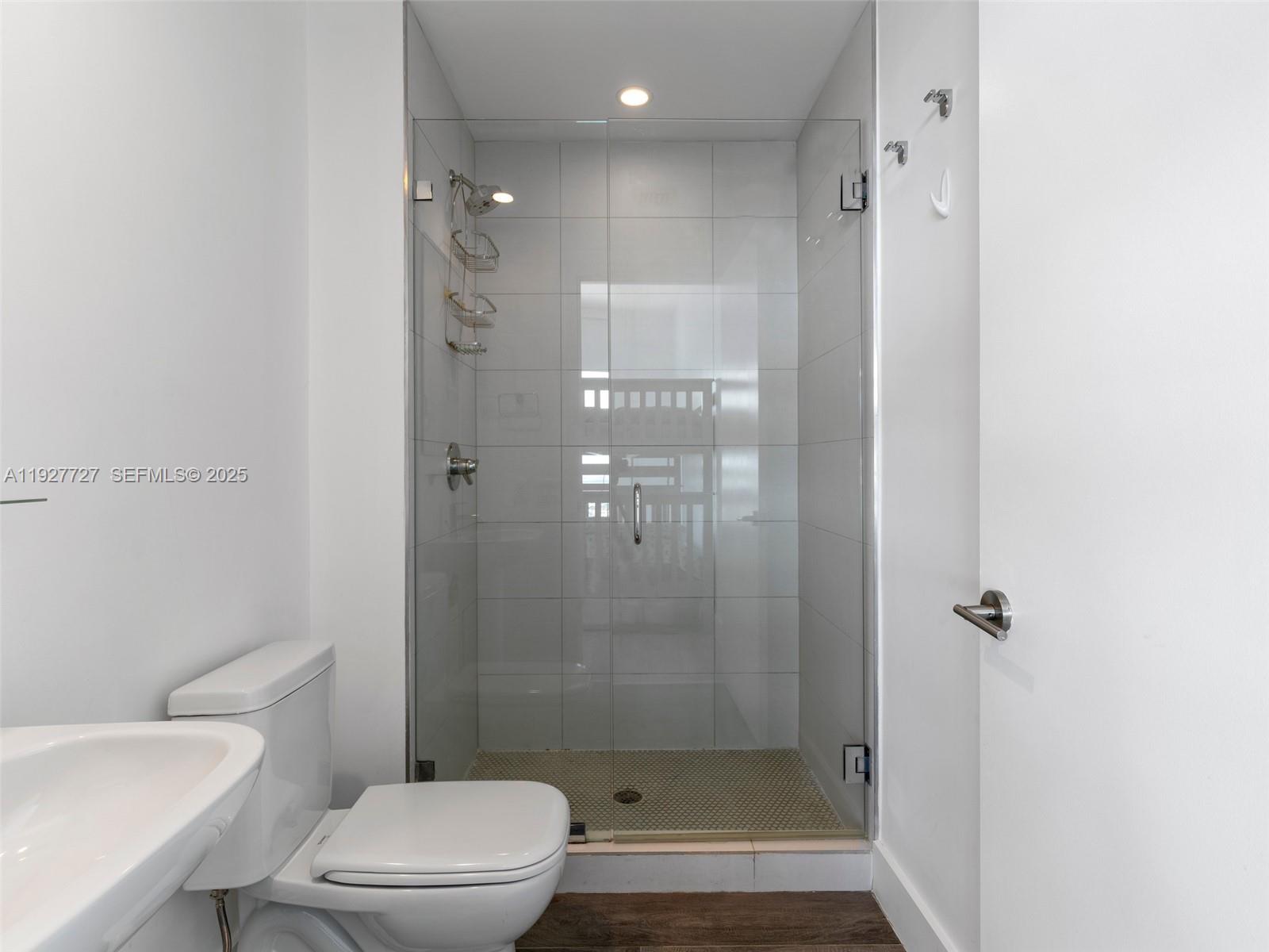 2900 Northeast 7th Avenue, Unit 4301 Miami, FL 33137 - Photo 21 of 24 a bathroom with a shower a toilet and sink