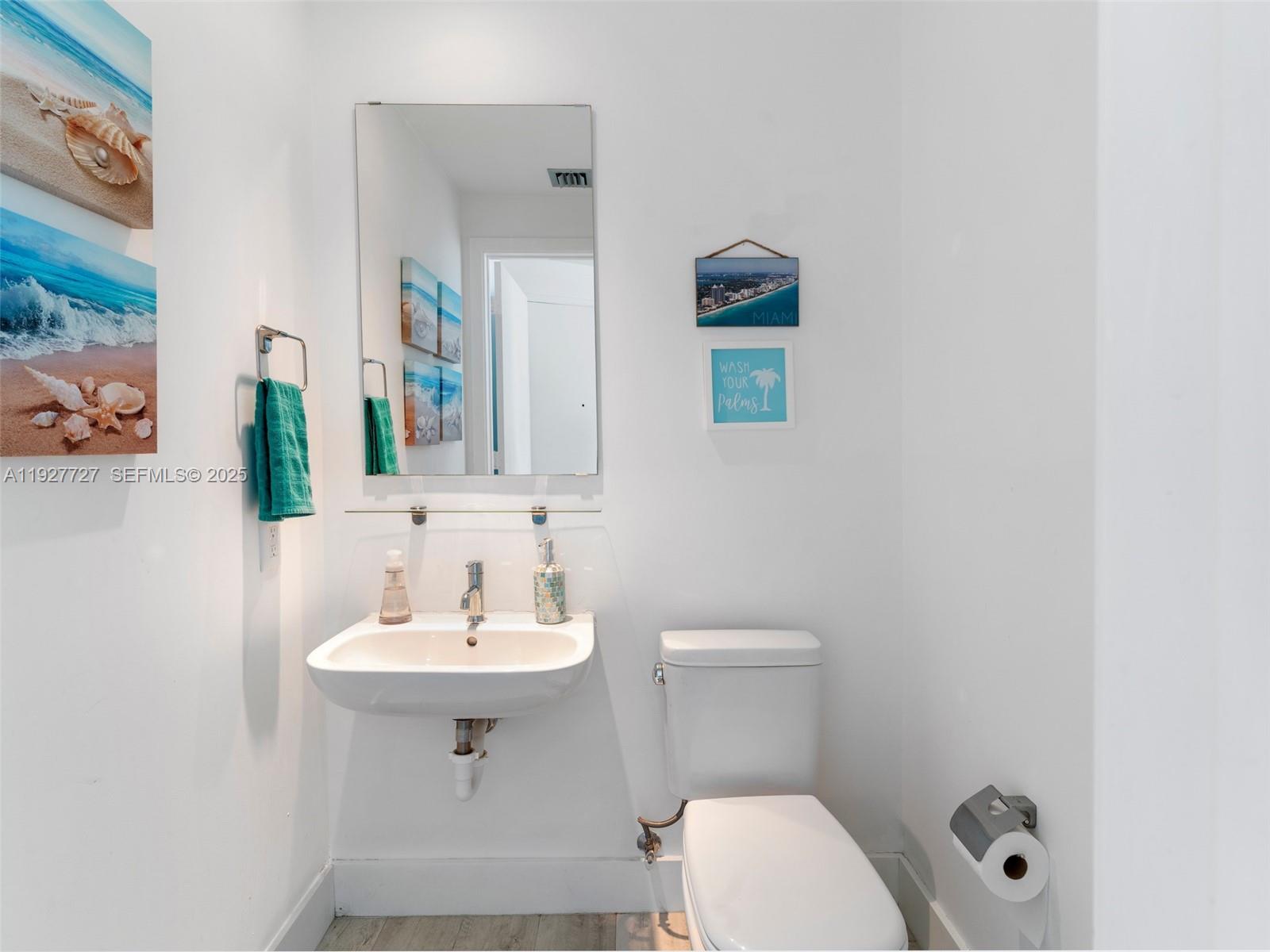 2900 Northeast 7th Avenue, Unit 4301 Miami, FL 33137 - Photo 22 of 24 a bathroom with a sink a toilet and mirror