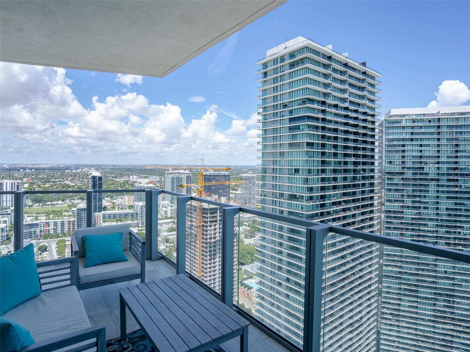 2900 Northeast 7th Avenue, Unit 4301 Miami, FL 33137 - Photo 23 of 24 a view of a balcony with a chairs