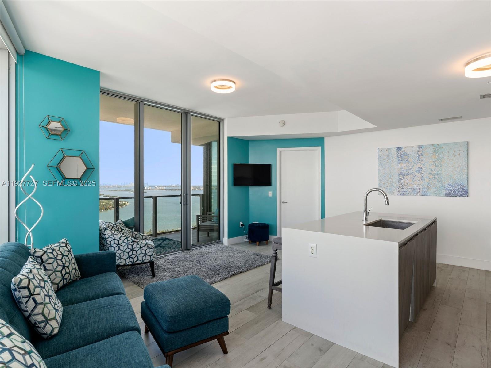 2900 Northeast 7th Avenue, Unit 4301 Miami, FL 33137 - Photo 9 of 24 a living room with furniture and a large window