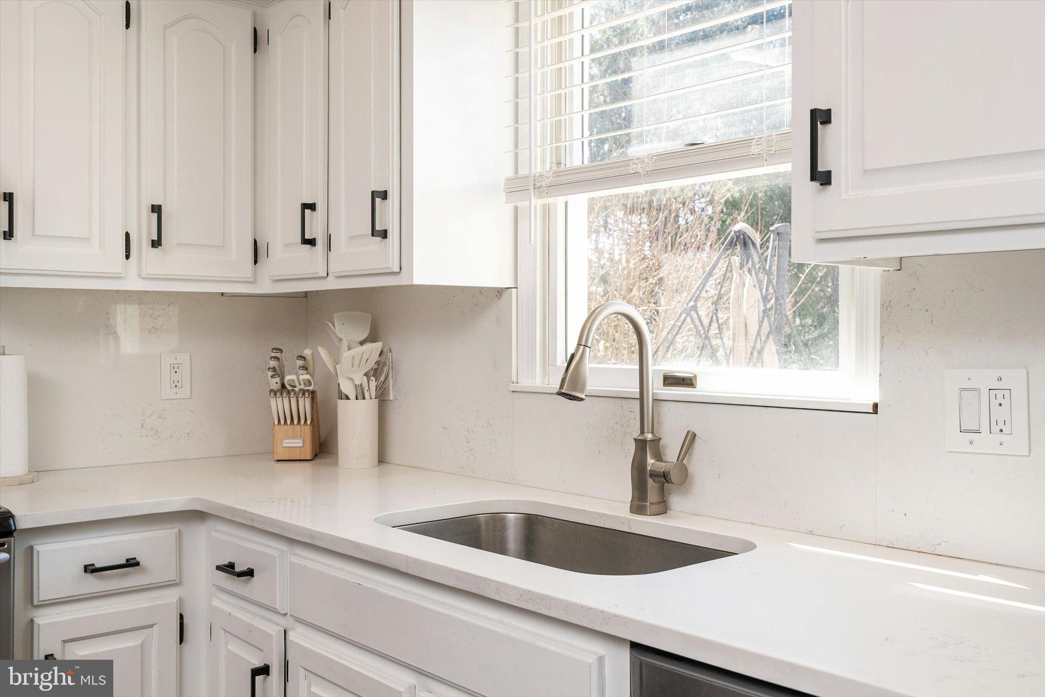 756 Province Line Road Allentown, NJ 08501 - Photo 15 of 41 a kitchen with white cabinets and a sink