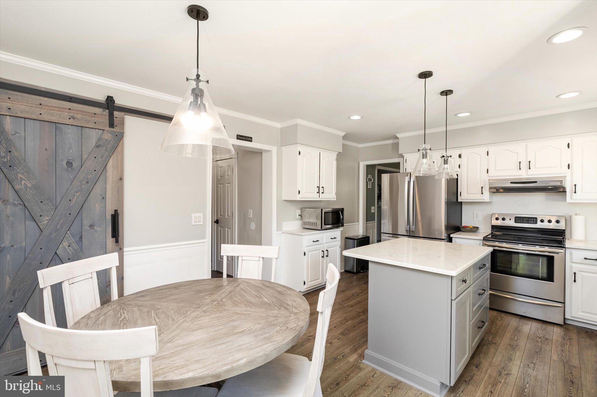 756 Province Line Road Allentown, NJ 08501 - Photo 16 of 41 a kitchen that has a stainless steel appliances a table and chairs