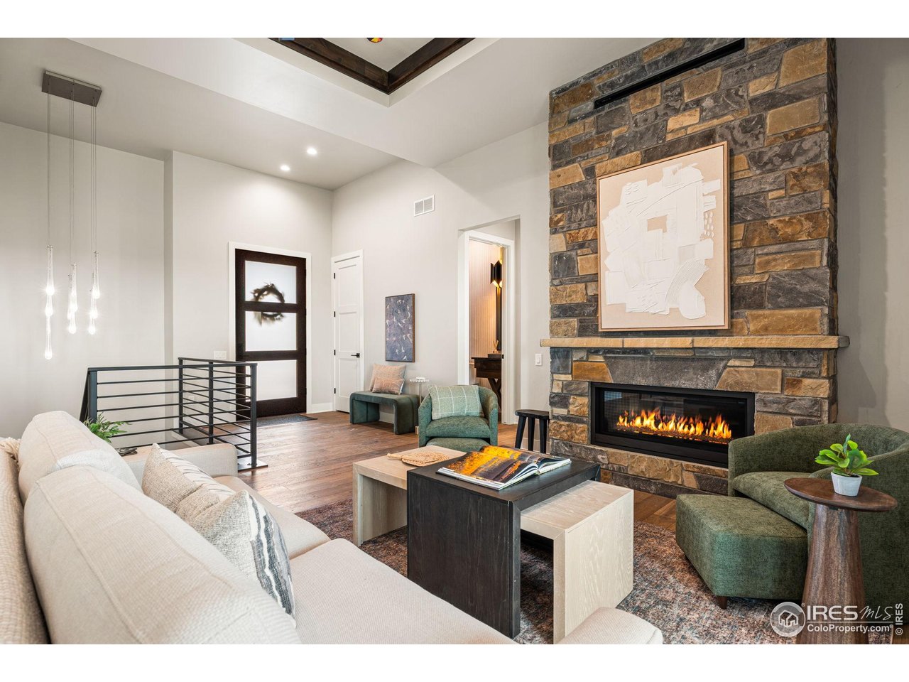 6719 Morning Song Court Timnath, CO 80547 - Photo 2 of 43 A stone fireplace warms the living room