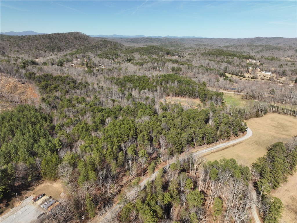 Tract B Old Unity Road Westminster, SC 29693 - Photo 3 of 12 This expansive aerial view showcases a vibrant landscape of rolling hills and lush woodlands.