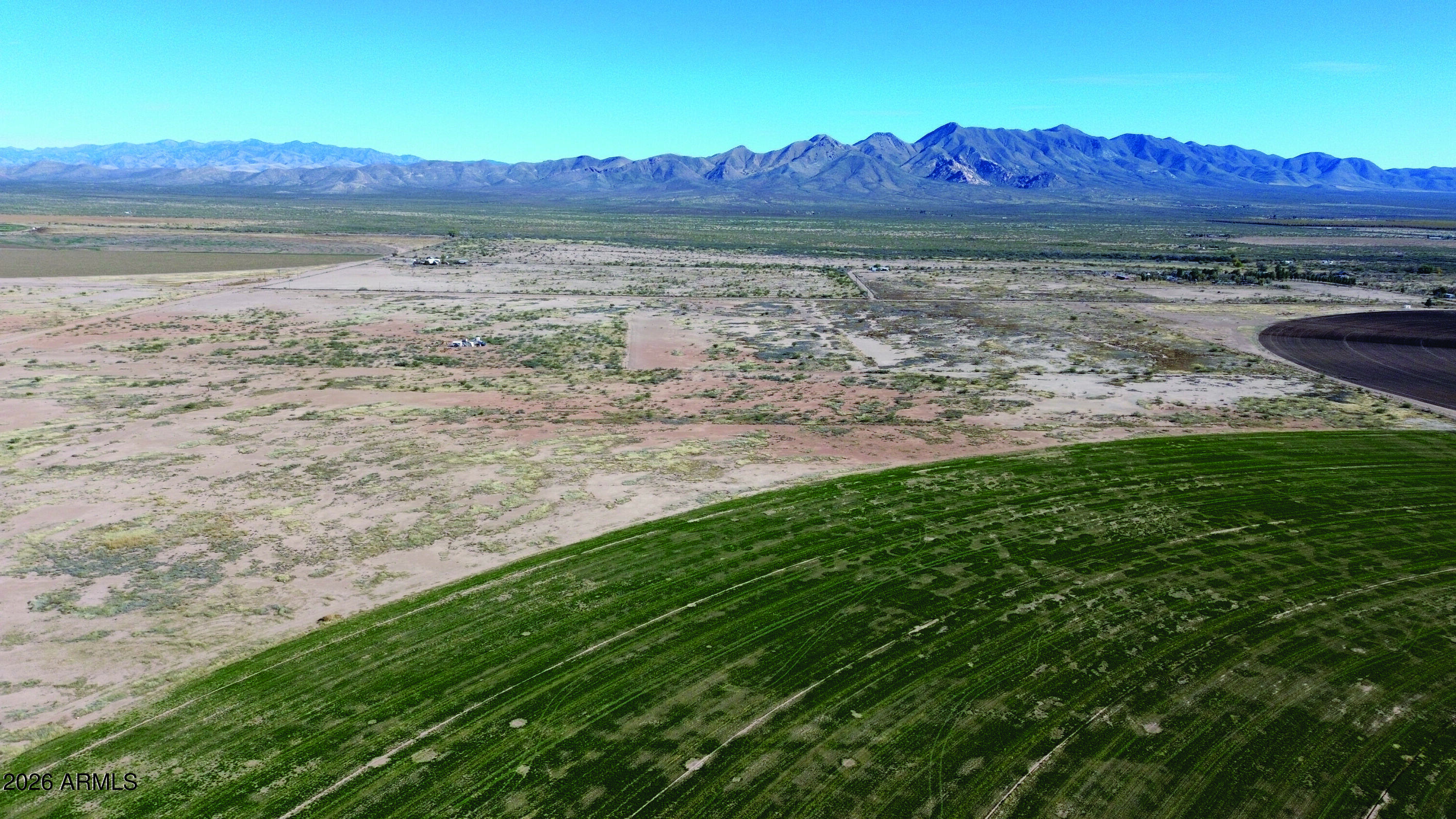 10-acres Thompson Road, Unit D Elfrida, AZ 85610 - Photo 13 of 33 a view of a lake with a yard and a mountain view