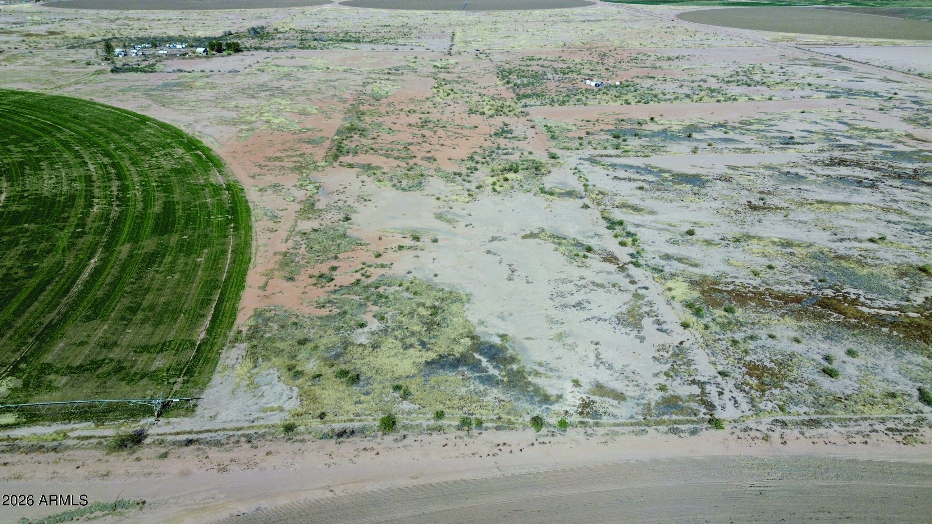 10-acres Thompson Road, Unit D Elfrida, AZ 85610 - Photo 9 of 33 a view of a dry yard with wooden fence