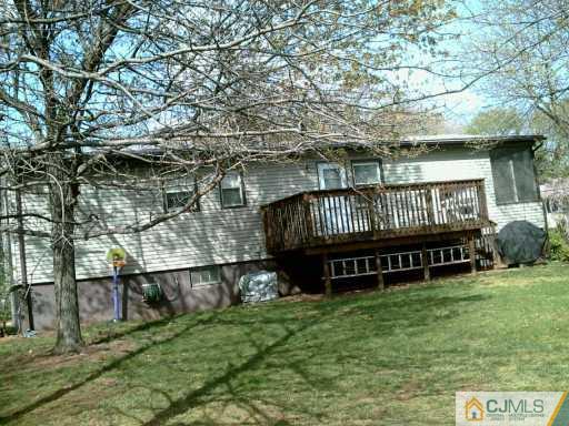 35 Peake Road Edison, NJ 08837 - Photo 8 of 8 a view of backyard with deck and garden