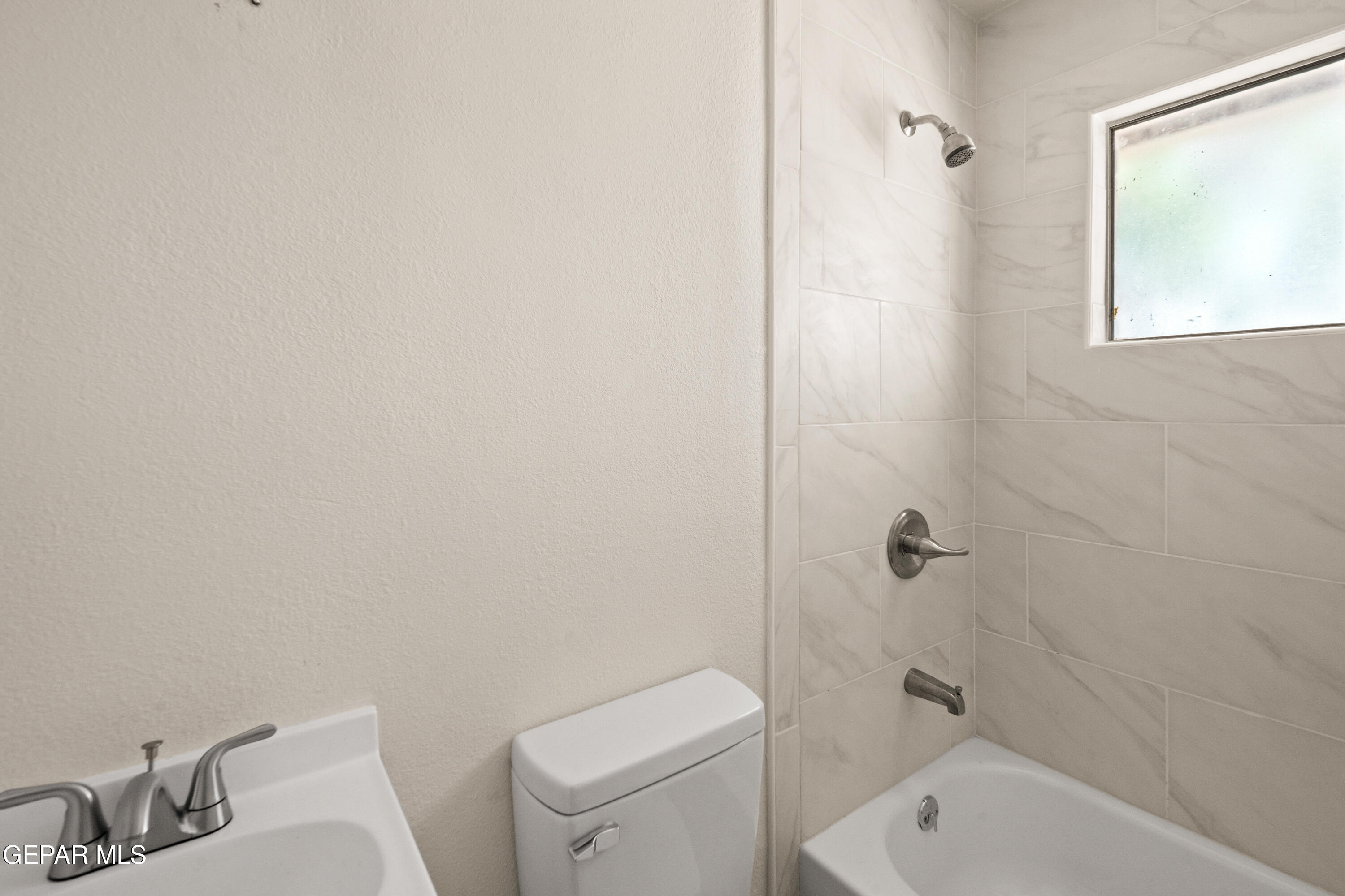 9220 Raleigh Drive El Paso, TX 79924 - Photo 16 of 23 a bathroom with a toilet and shower