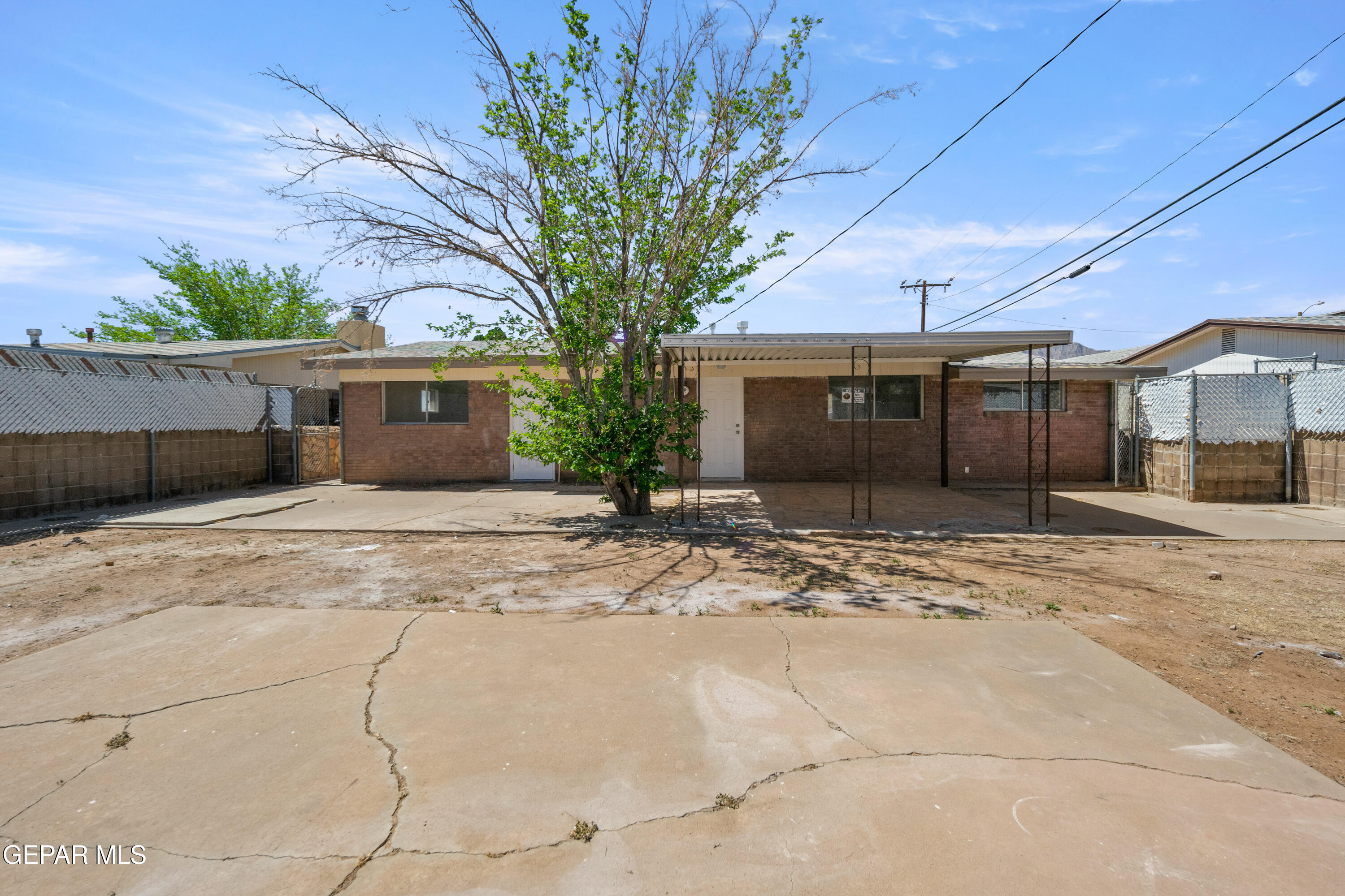 9220 Raleigh Drive El Paso, TX 79924 - Photo 20 of 23 a front view of a house with a yard and garage