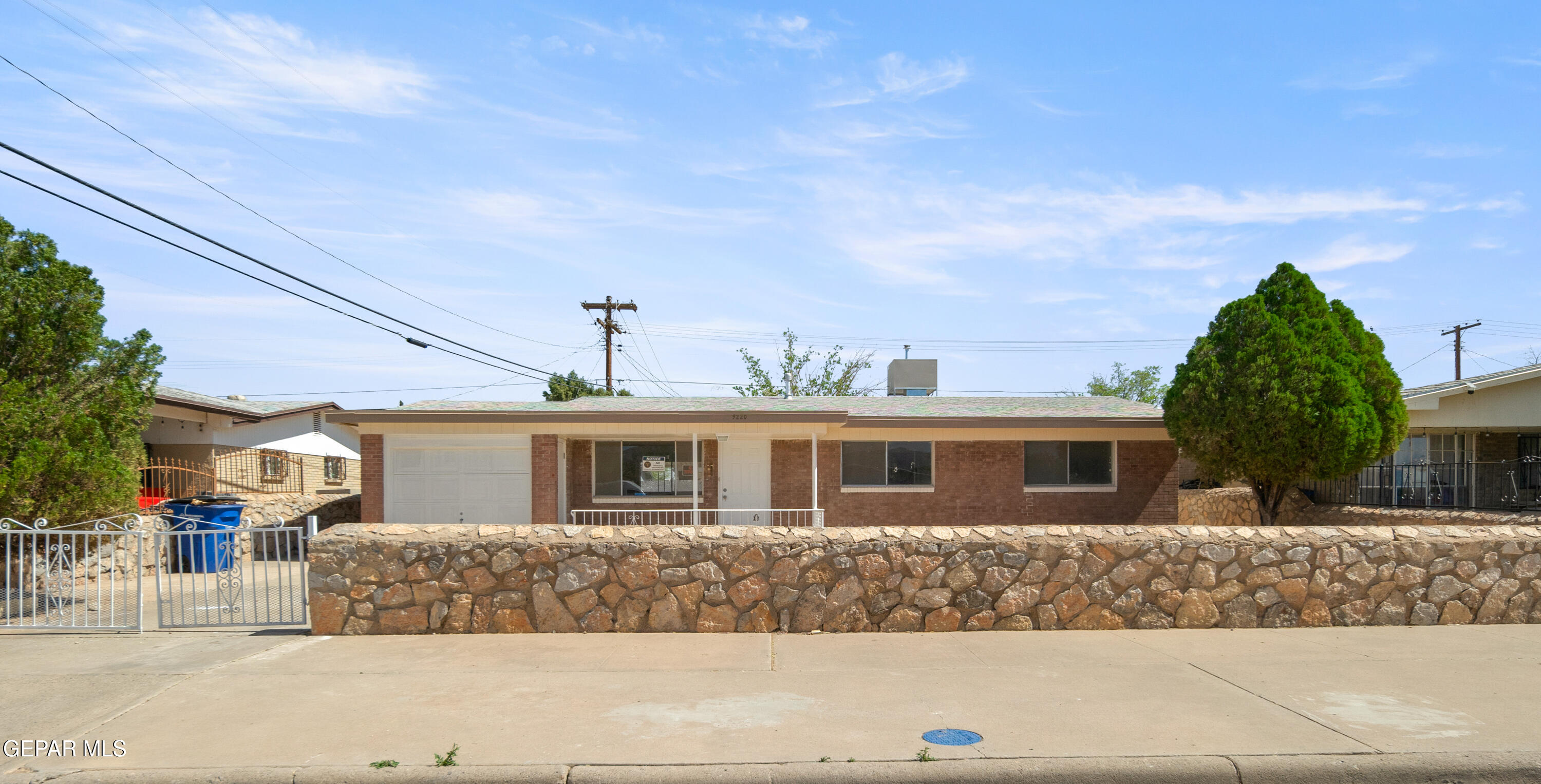 9220 Raleigh Drive El Paso, TX 79924 - Photo 2 of 23 a front view of a house with a yard