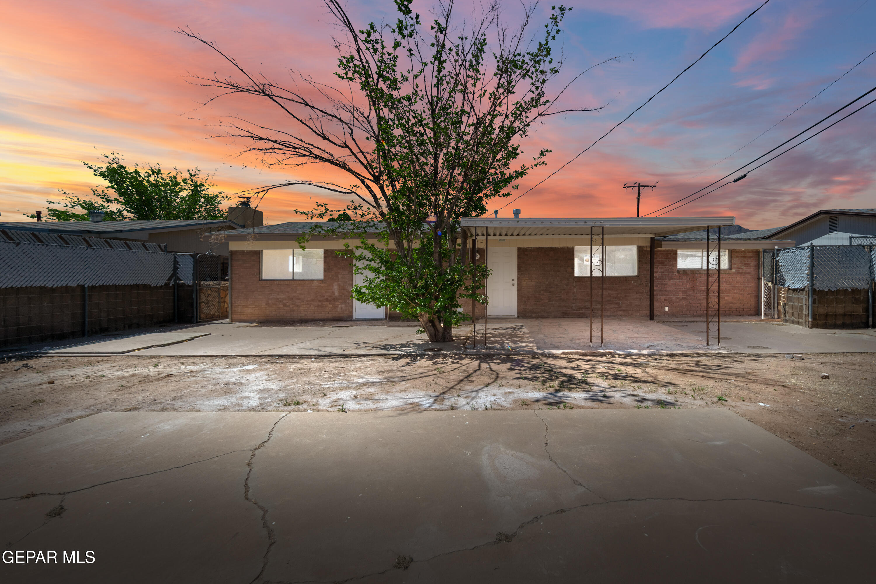 9220 Raleigh Drive El Paso, TX 79924 - Photo 21 of 23 a front view of a house with a yard