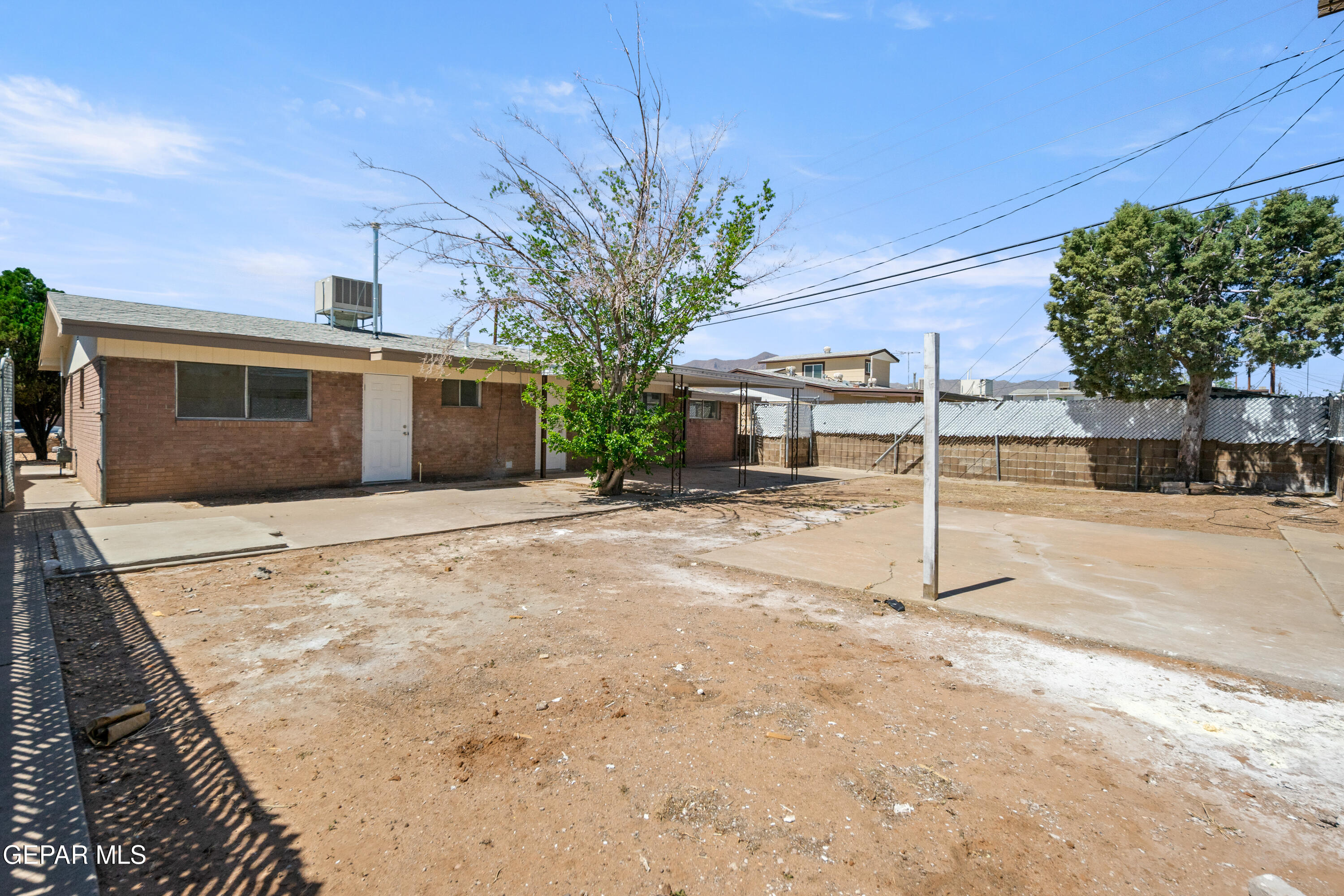 9220 Raleigh Drive El Paso, TX 79924 - Photo 23 of 23 a backyard of a house with table and chairs