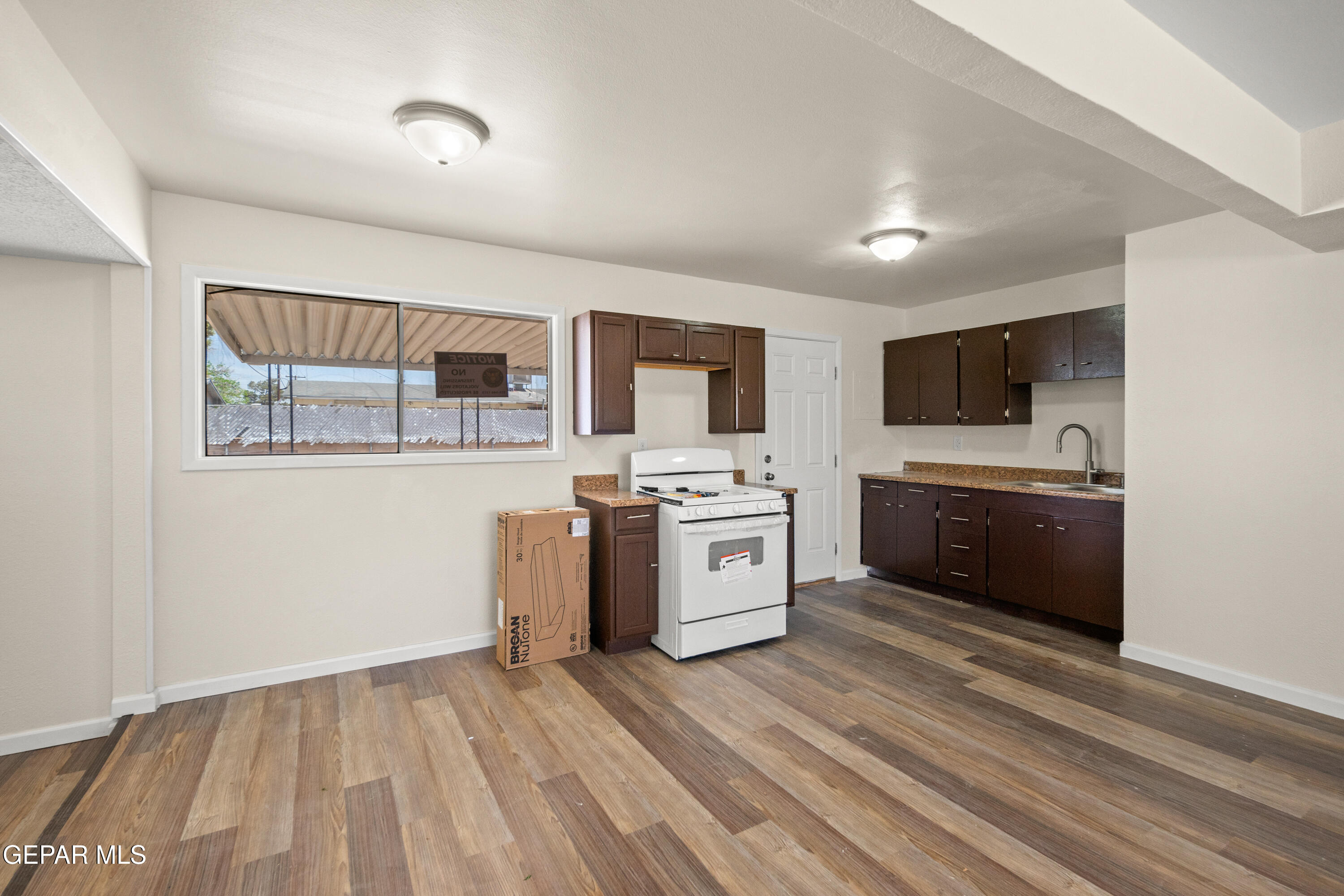 9220 Raleigh Drive El Paso, TX 79924 - Photo 7 of 23 a view of kitchen with sink and wooden floor