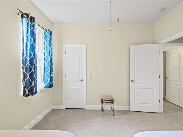 a view of backyard of house with green space