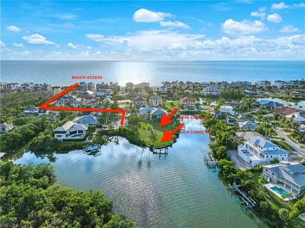 an aerial view of a house with a lake view
