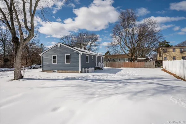 a view of a house with a snow on the road