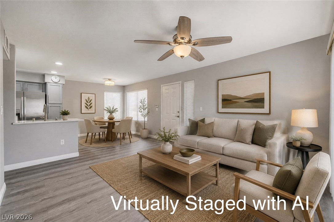 3425 East Russell Road, Unit 223 Las Vegas, NV 89120 - Photo 15 of 47 An open concept living and dining area boasts ample natural light and modern flooring.