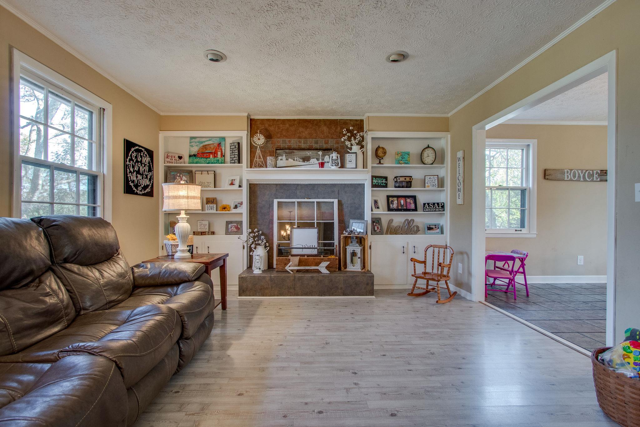 835 Beasleys Bend Road Lebanon, TN 37087 - Photo 12 of 33 a living room with furniture and a fireplace