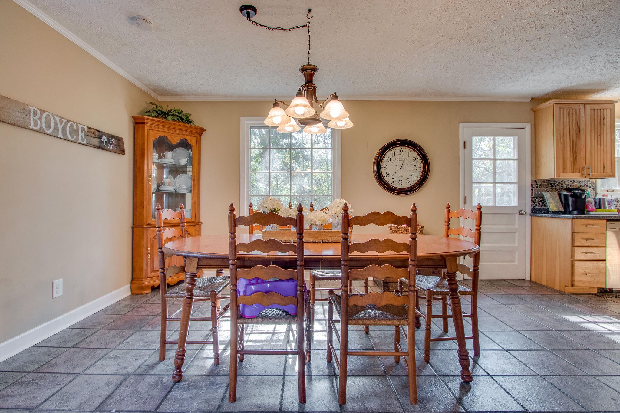 835 Beasleys Bend Road Lebanon, TN 37087 - Photo 17 of 33 a view of a dining room with furniture window and wooden floor