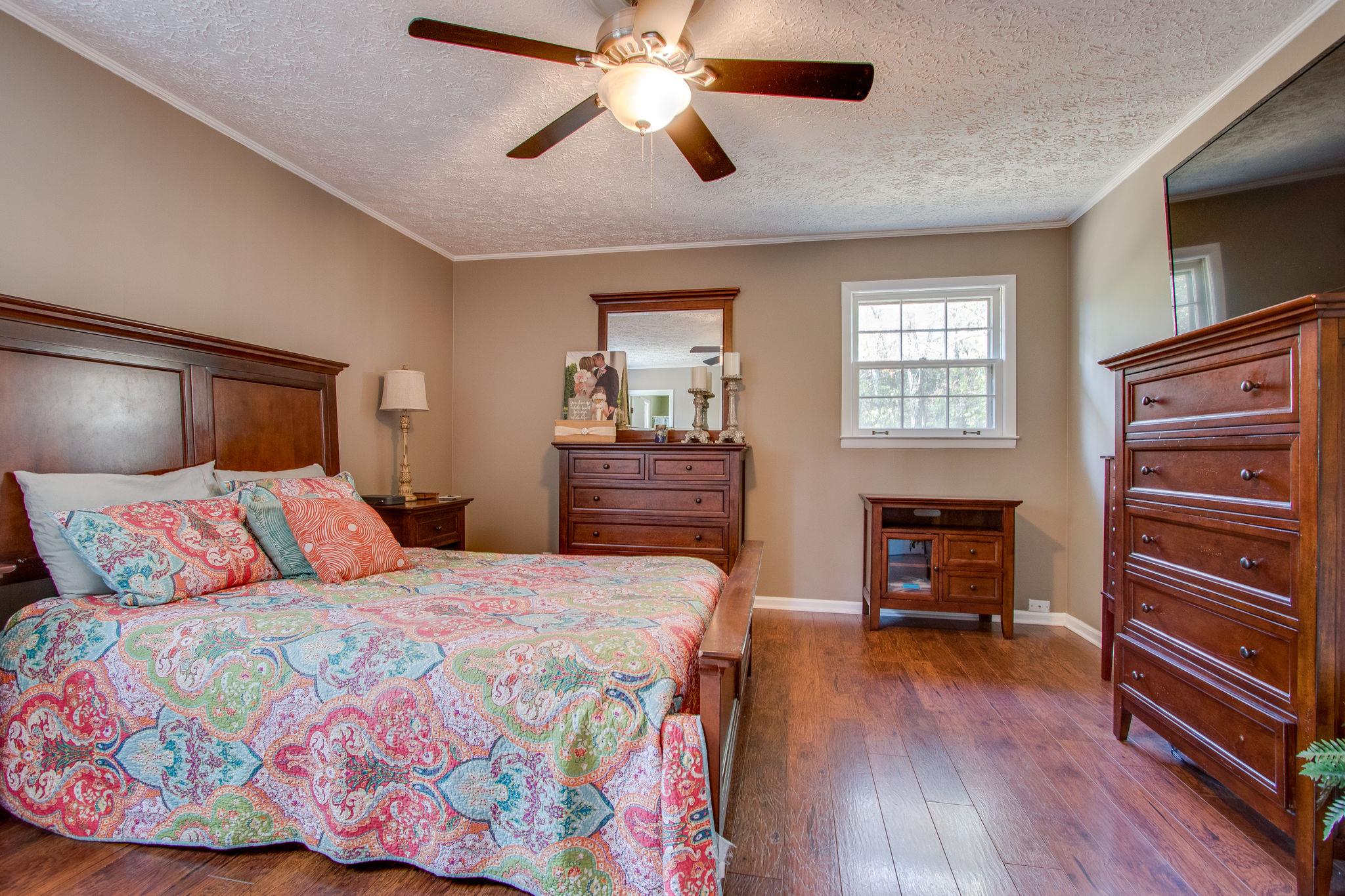 835 Beasleys Bend Road Lebanon, TN 37087 - Photo 18 of 33 a bedroom with a bed and wooden floor