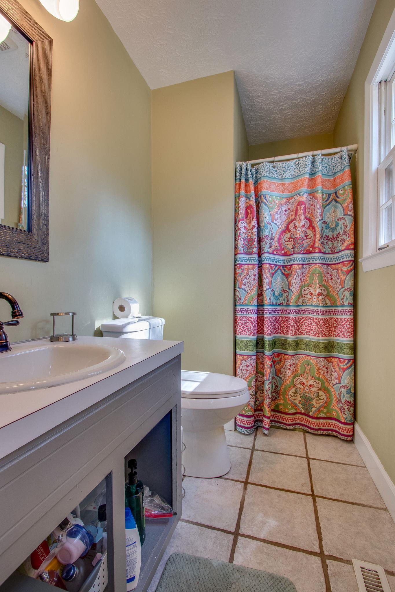 835 Beasleys Bend Road Lebanon, TN 37087 - Photo 20 of 33 a bathroom with a sink a toilet and shower