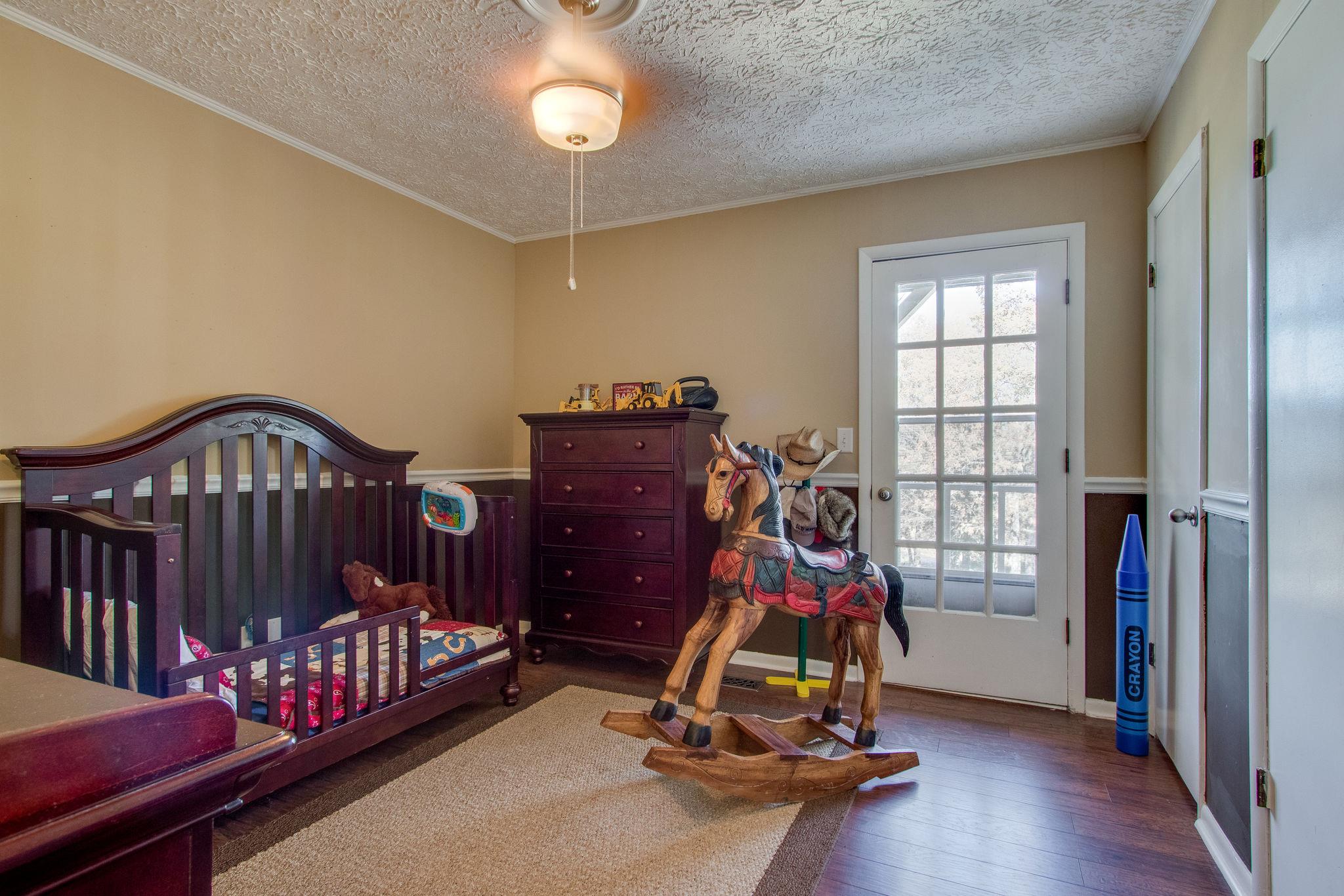 835 Beasleys Bend Road Lebanon, TN 37087 - Photo 21 of 33 a bedroom with furniture and windows