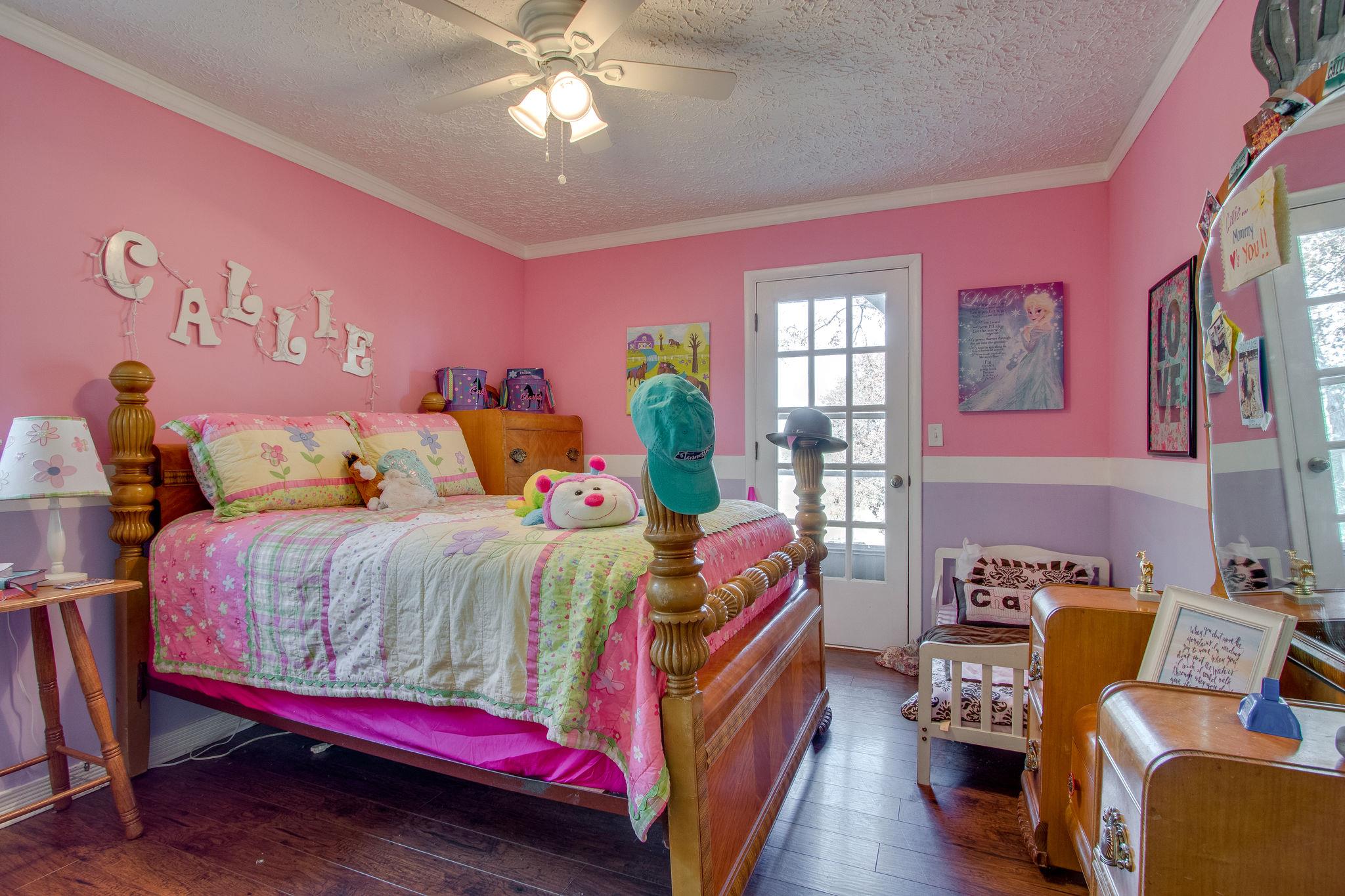 835 Beasleys Bend Road Lebanon, TN 37087 - Photo 24 of 33 a bedroom with a bed and wooden floor