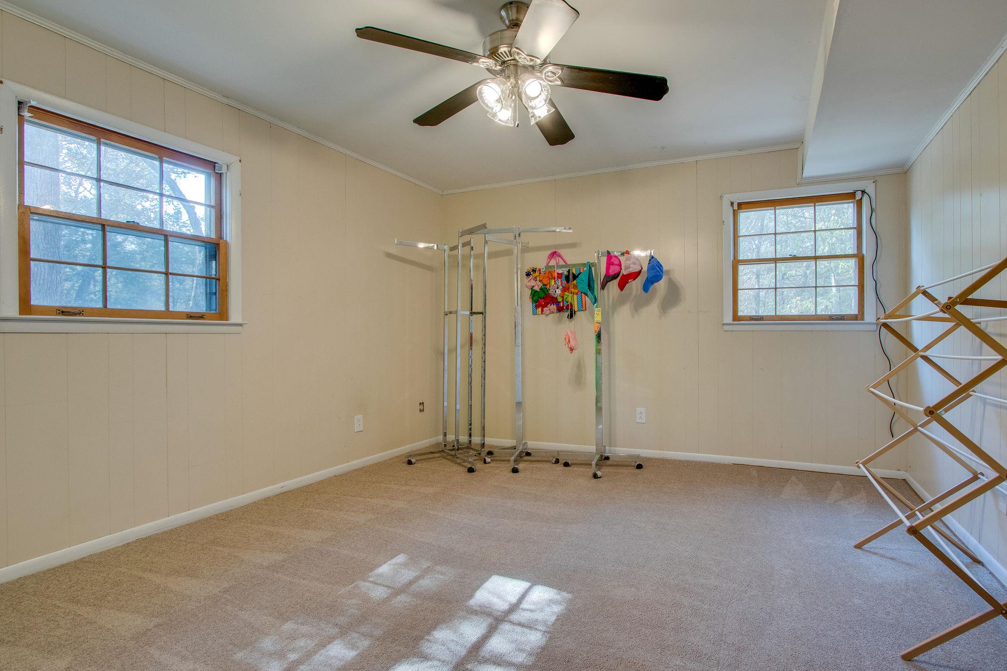 835 Beasleys Bend Road Lebanon, TN 37087 - Photo 29 of 33 a view of a livingroom with a ceiling fan and window