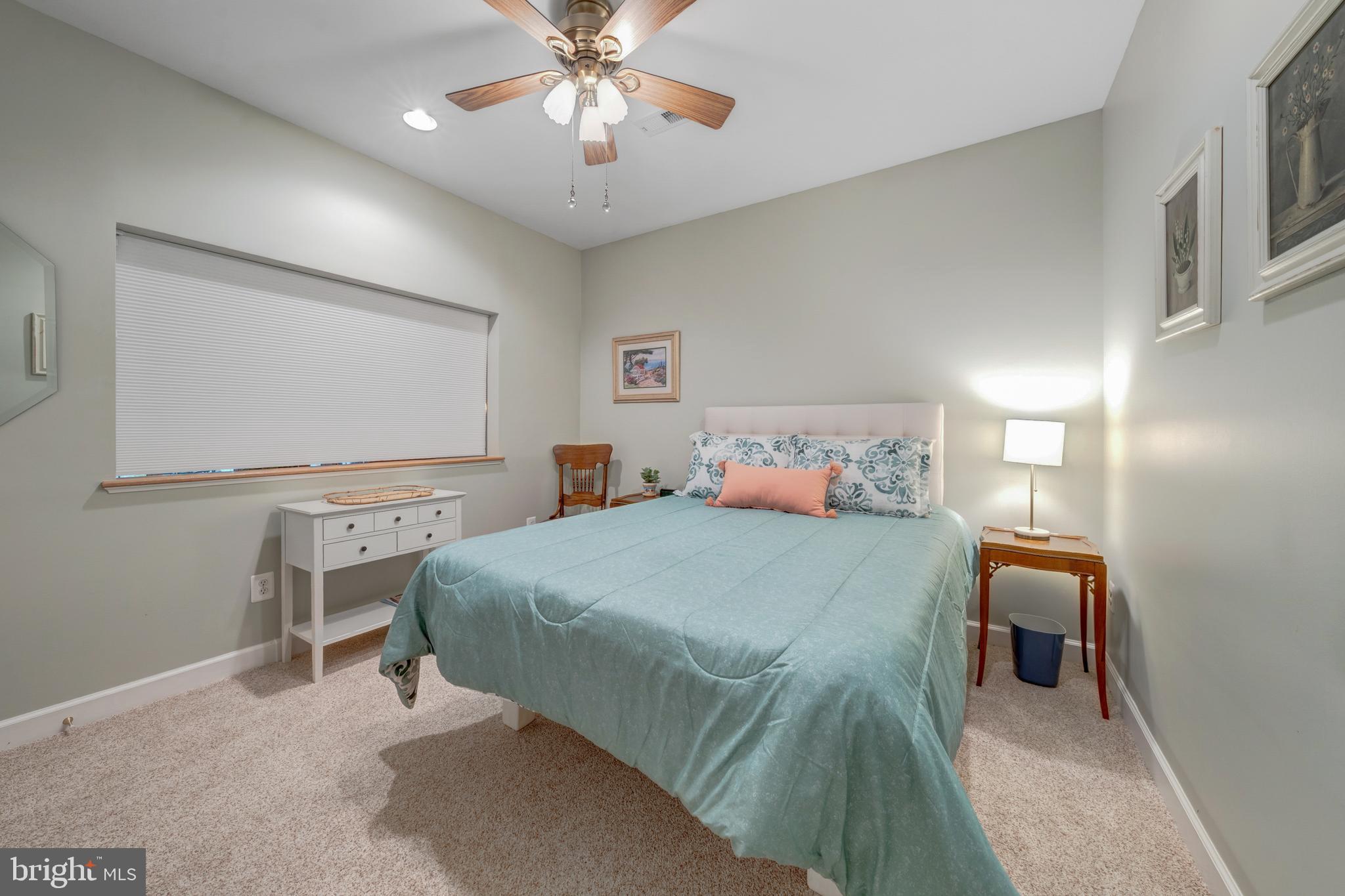 1925 Logan Manor Drive Reston, VA 20190 - Photo 37 of 61 a bedroom with a bed and a chandelier