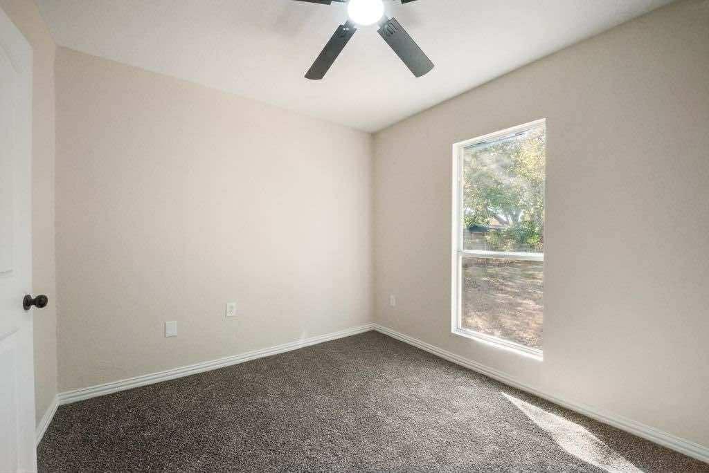 1802 Gus Thomasson Road Dallas, TX 75228 - Photo 13 of 17 a view of room with window and ceiling fan
