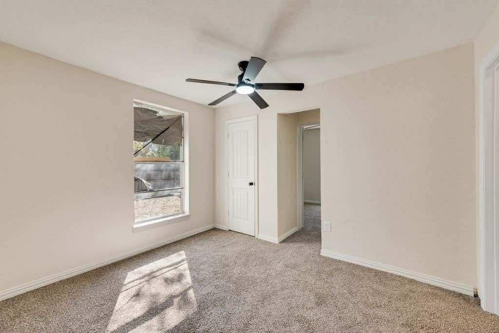 1802 Gus Thomasson Road Dallas, TX 75228 - Photo 14 of 17 an empty room with windows and fan