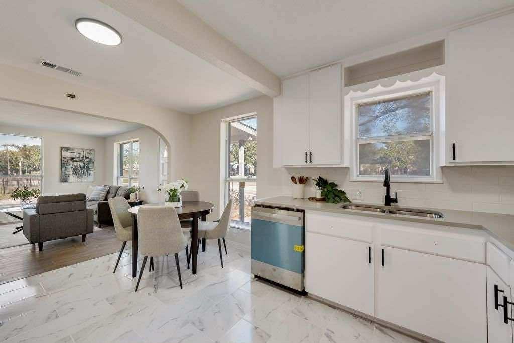 1802 Gus Thomasson Road Dallas, TX 75228 - Photo 6 of 17 a kitchen with a sink table and chairs