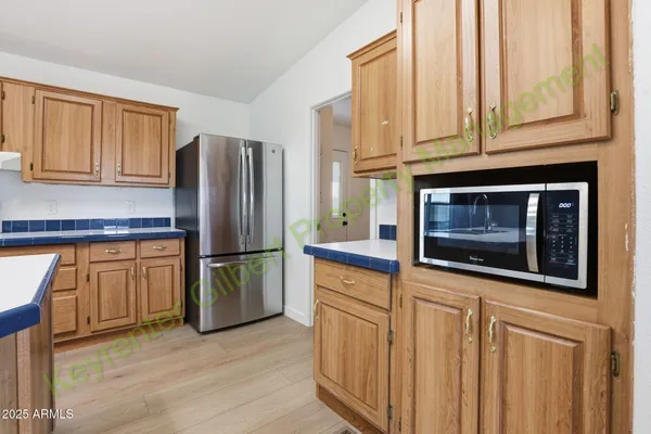an empty room with wooden floor and sliding door