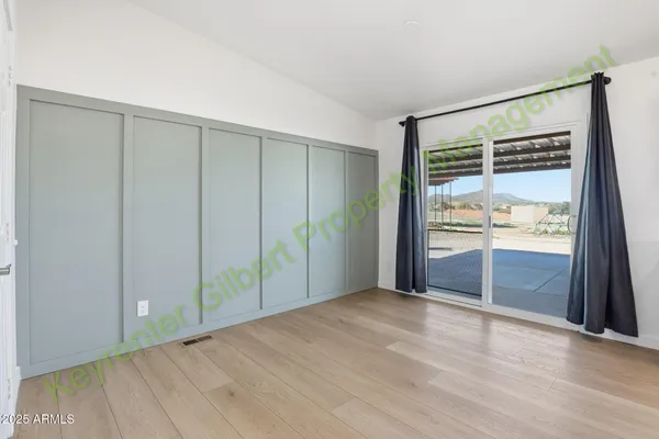 a view of an entryway with wooden floor