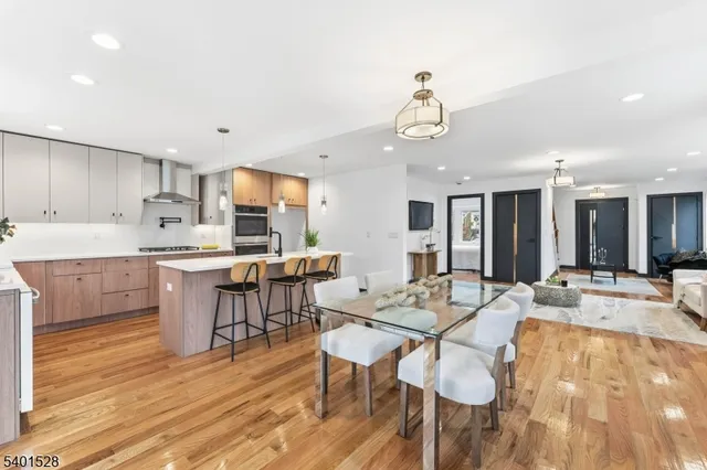 a large kitchen with a table and chairs