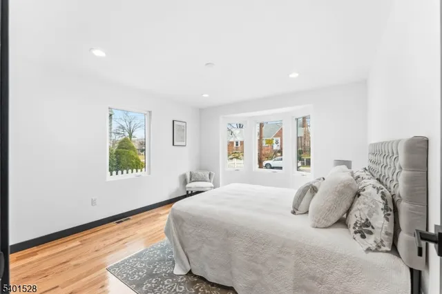 a bedroom with furniture and a window