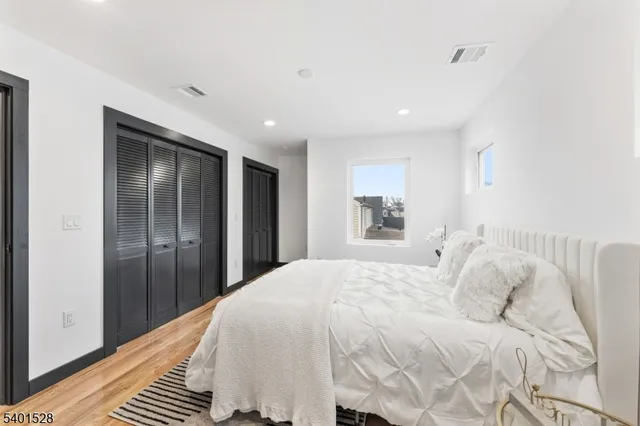 a large white bed in a white room