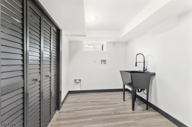 a view of a room with a table and chairs