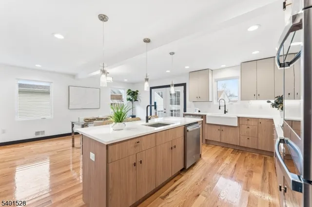 a kitchen with a sink stove and cabinets
