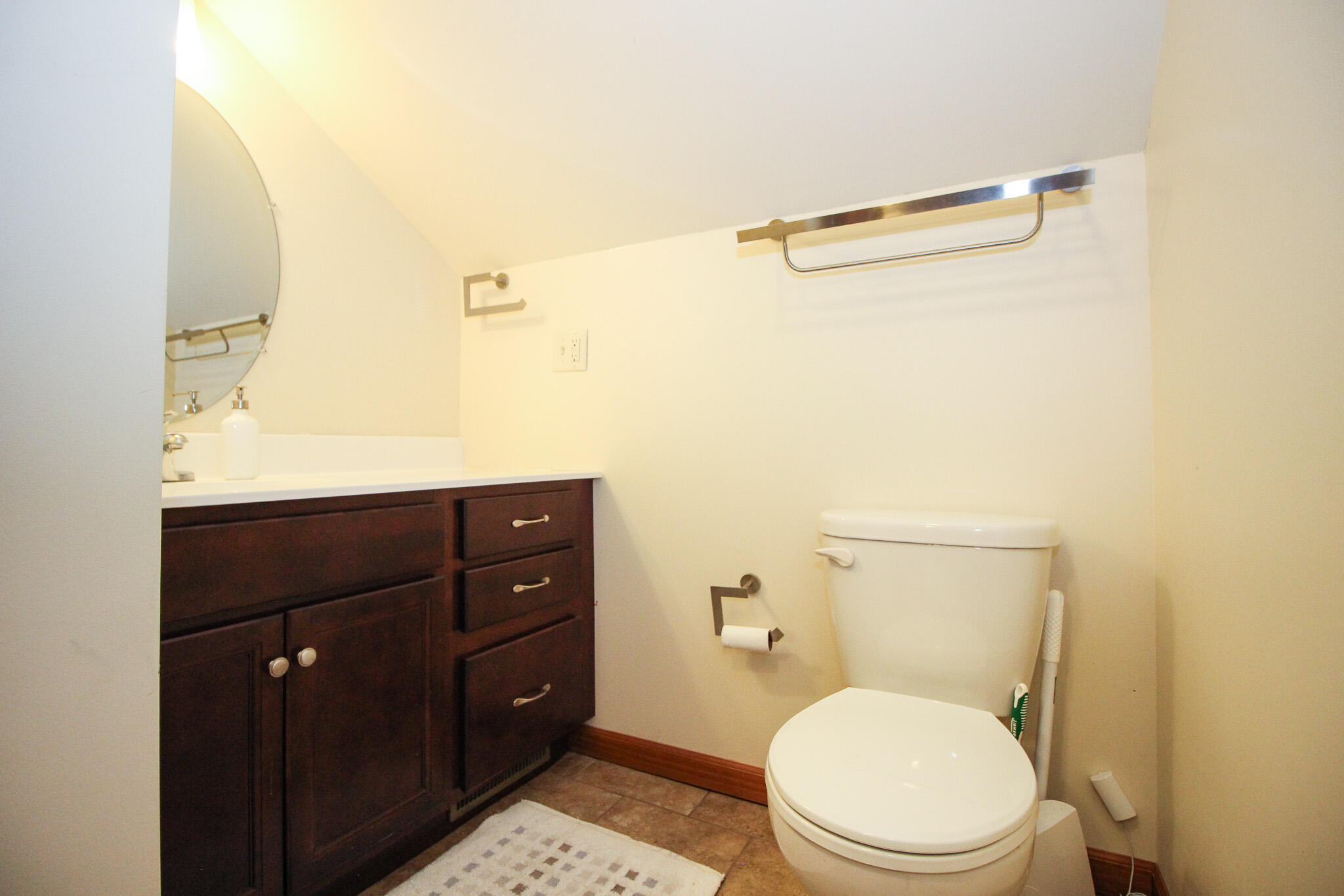 2913 Cardinal Drive Wheatfield, IN 46392 - Photo 24 of 34 a bathroom with a toilet a sink and mirror